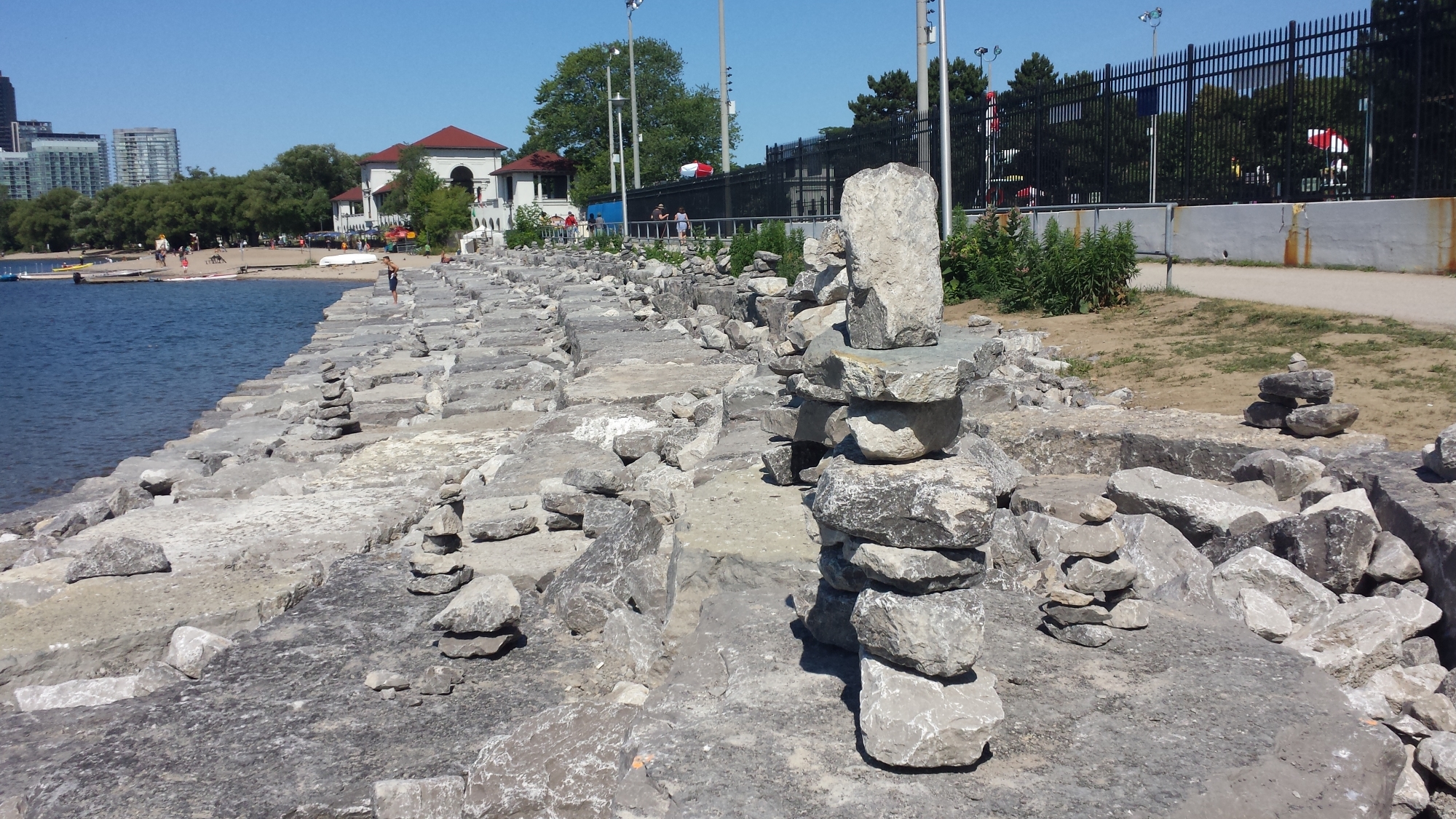 Row of rock sculptures behind Summyside pool in Toronto.