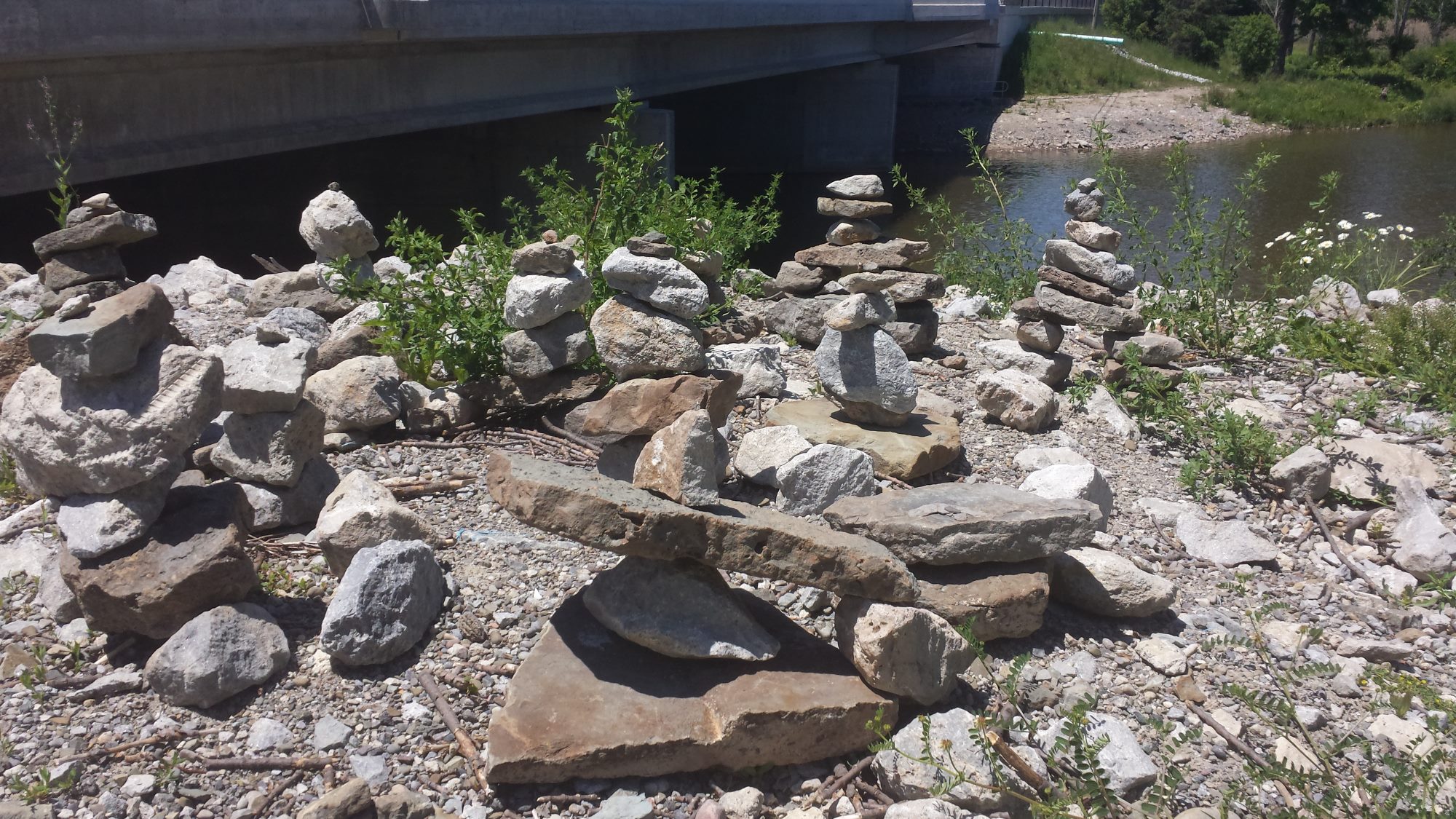 Rock sculptures in a circular pattern on the Credit River banks